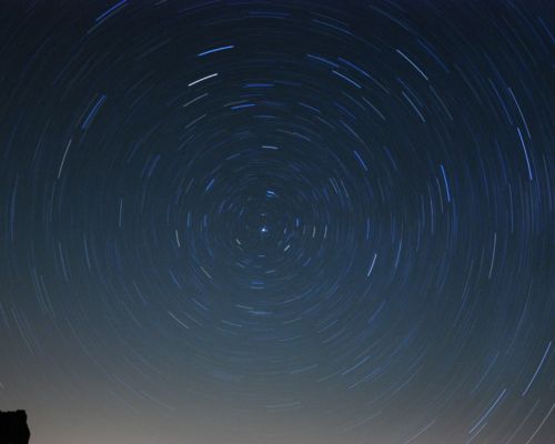 Starry night sky above Wadi Rum camp in the desert